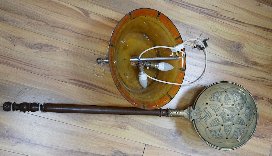 An Art Deco glass light shade, 40cm diameter, and an embossed brass warming pan, 194cm long. Condition - poor to fair